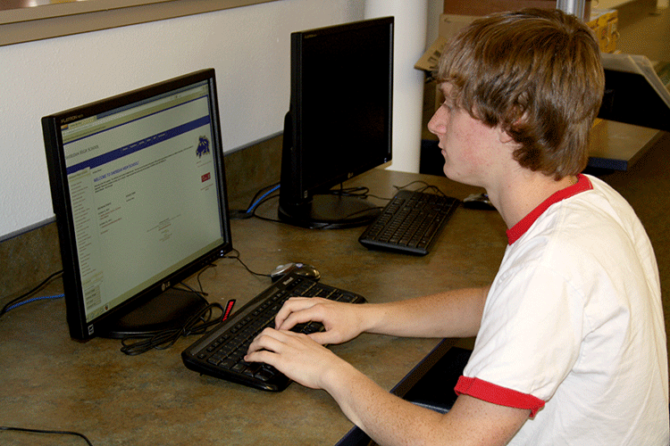 Senior Kolby Brown uses the new computers during his free hour.