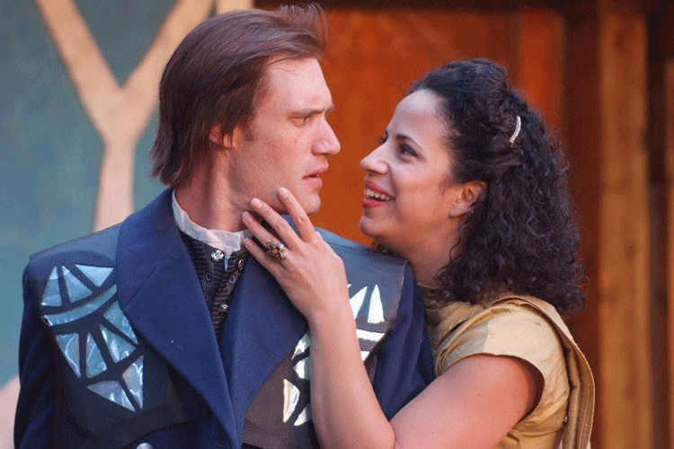 Two cast members of Montana Shakespeare in the School share an intimate moment on stage.