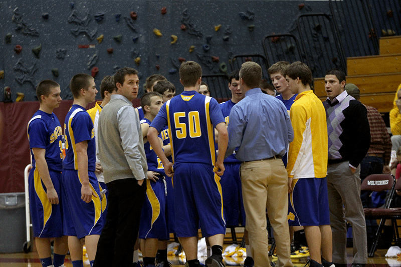 Head coach Gale Smith encourages the Broncs during a timeout against Billings West. 