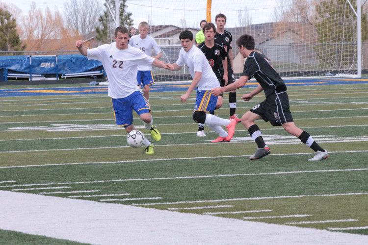 The SHS soccer team battles to score a goal during a home game. 