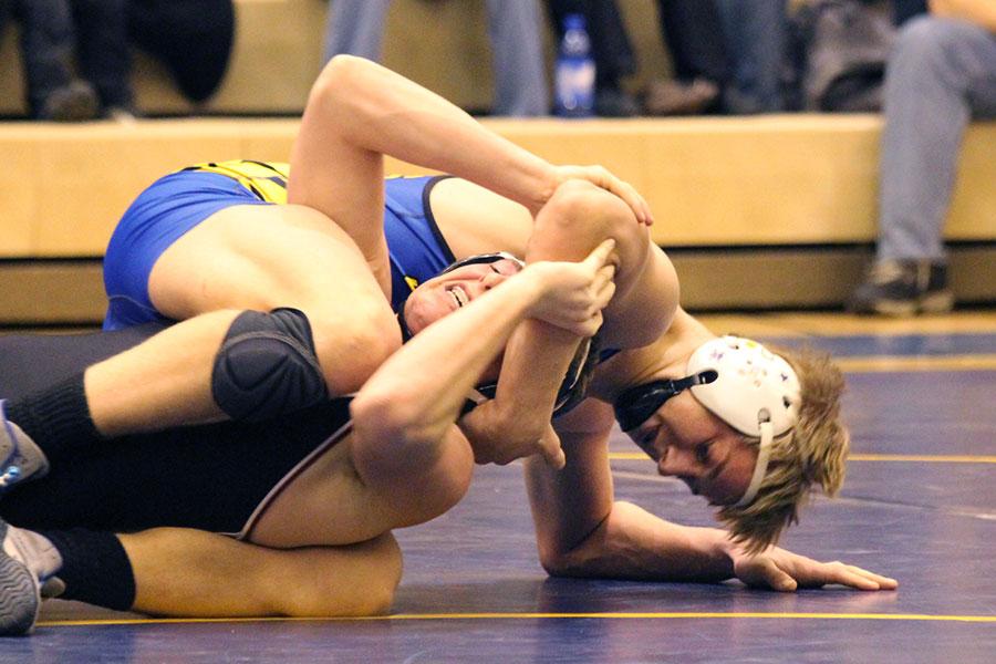 Senior Timmy Cowen dominates his opponent in a match on Jan. 4