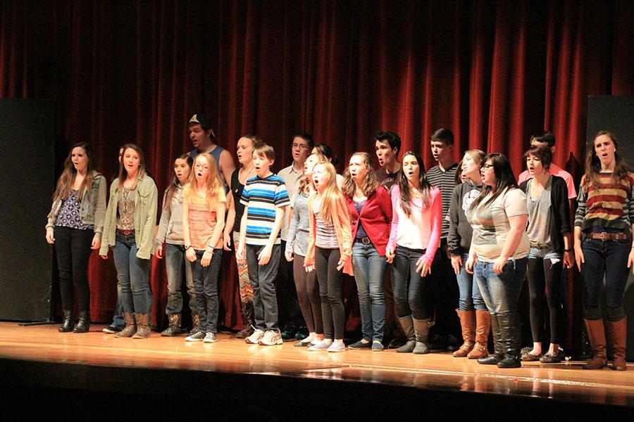 The cast of 13 sings their closing song.