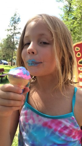 Eight-year-old Sanna Kleine enjoys an ice cream cone at Kendrick Park. Even though the stand isn't open yet, don't let that discourage you from such a special treat!