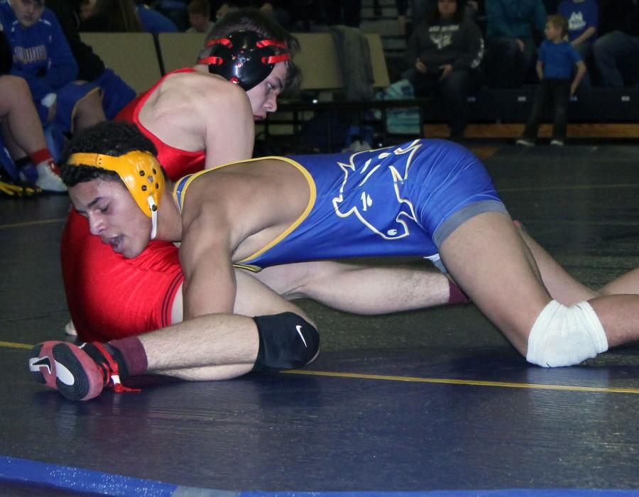 Senior Dominic Miller competes in a wrestling tournament at the Sheridan Junior High School gym.
