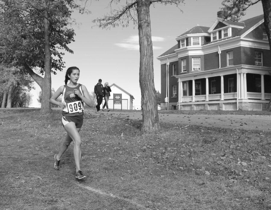 Senior girls varsity runner Xiomara Robinson races through the last quarter mile of her 5K at the Sheridan VA Medical Center state cross country meet on Saturday, Oct. 22, 2016. 