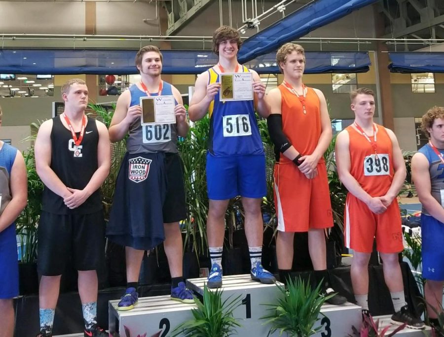 Myers+stands+on+the+podium+for+indoor+state+championship+with+his+state+champion+title+award.+%28Photo+courtesy+Patty+Myers%29