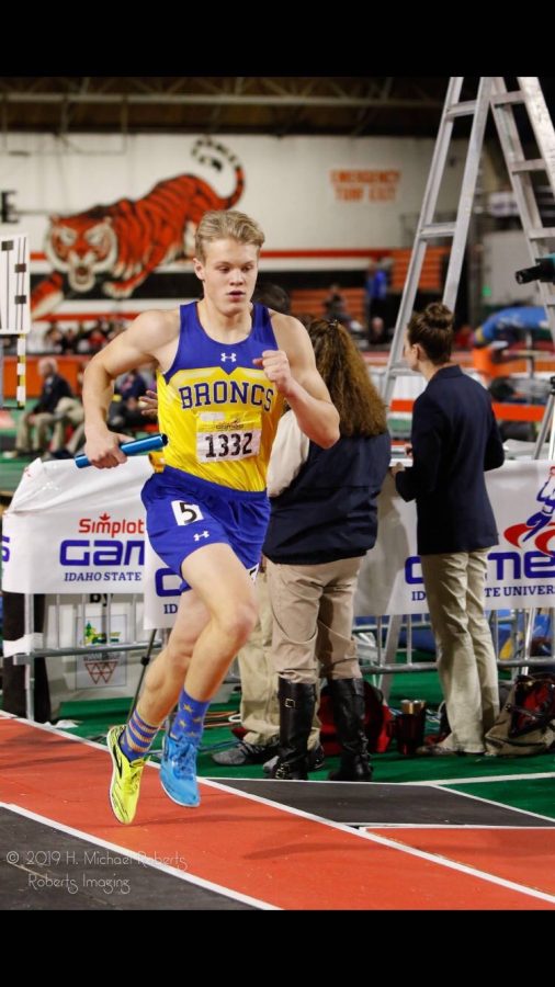 Shaw runs the 4 by 800 relay at Simplot games in the 2019 track season.