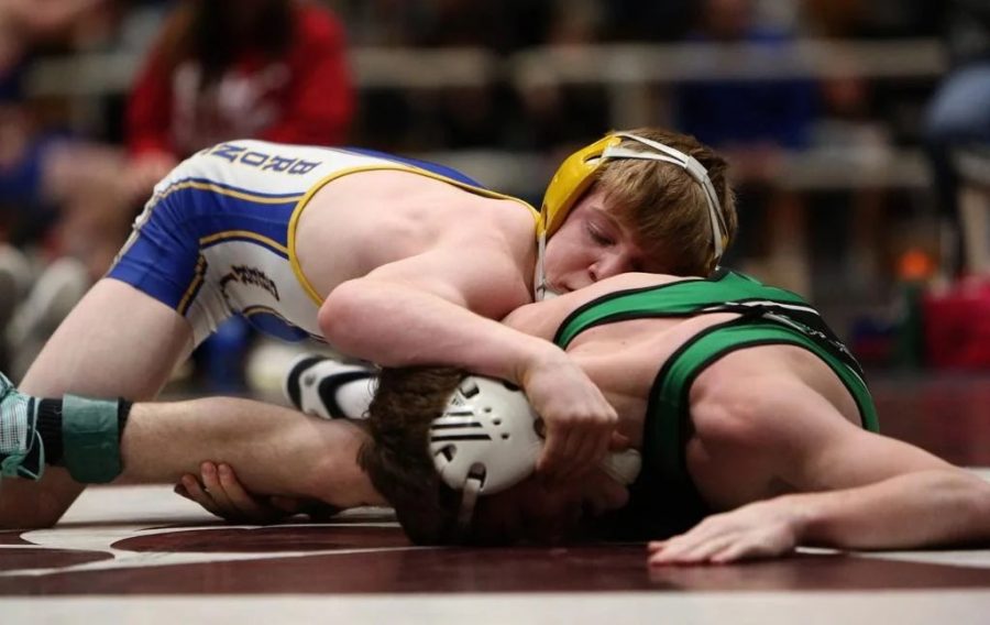 Senior Reese Osborne makes a move on Moorcroft opponent during Ron Thon Memorial Invitational in Riverton, Wyo. 