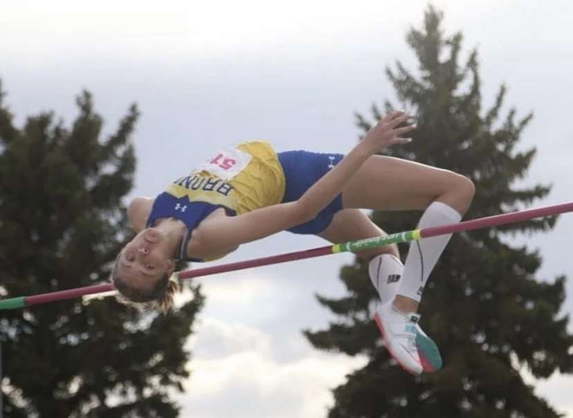 Carroll+confidently+completes+her+jump+over+the+bar+at+the+high+jump+events+during+a+home+meet+at+Sheridan+High+School.+%28Photo+courtesy+Ashley+Cooper%29